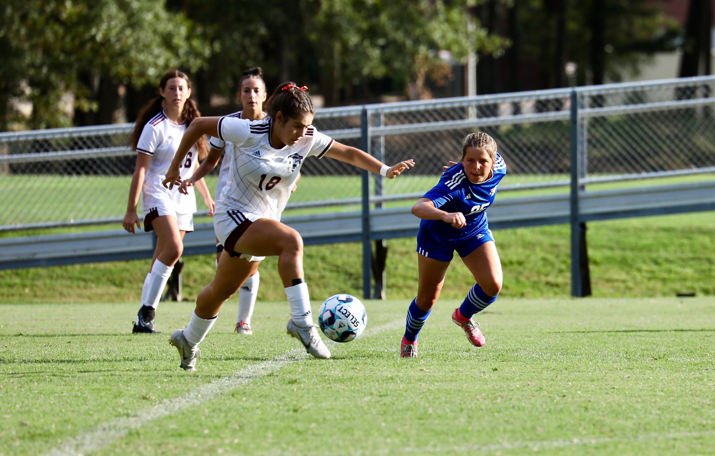 Cooper’s Hat Trick Propels Lady Wolves to Conference Opening Win